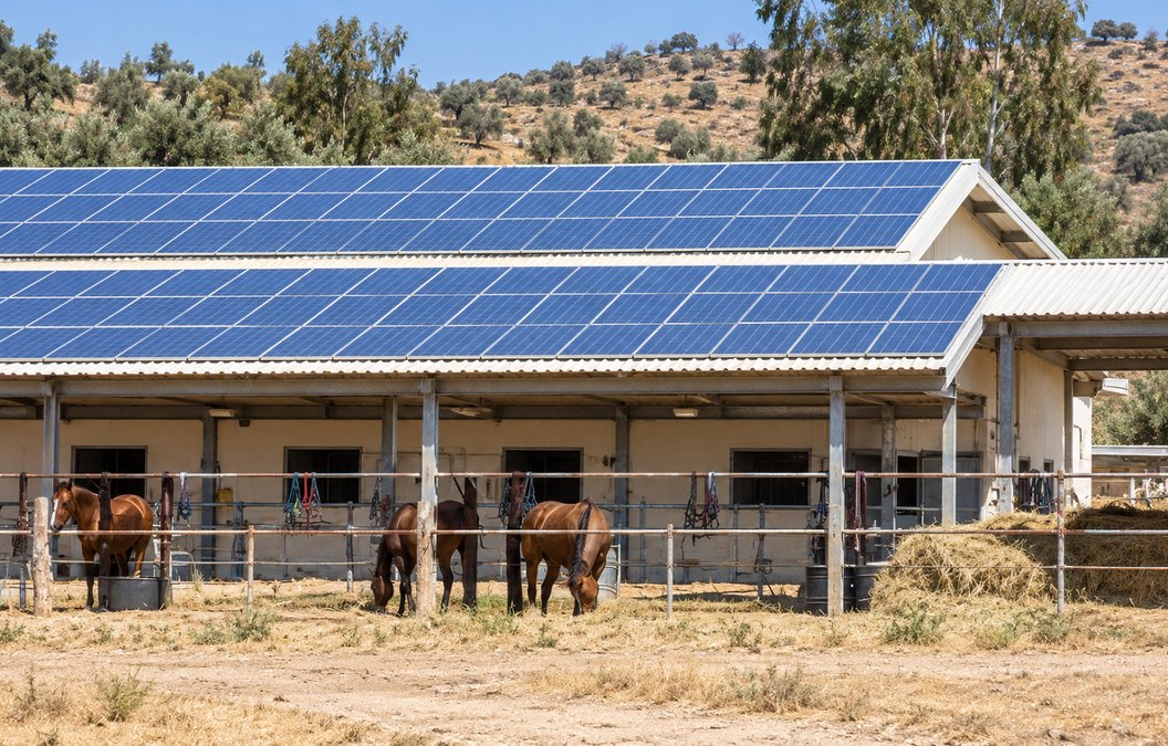 A solar system on the roof of a farm building on Plot A of a moshav